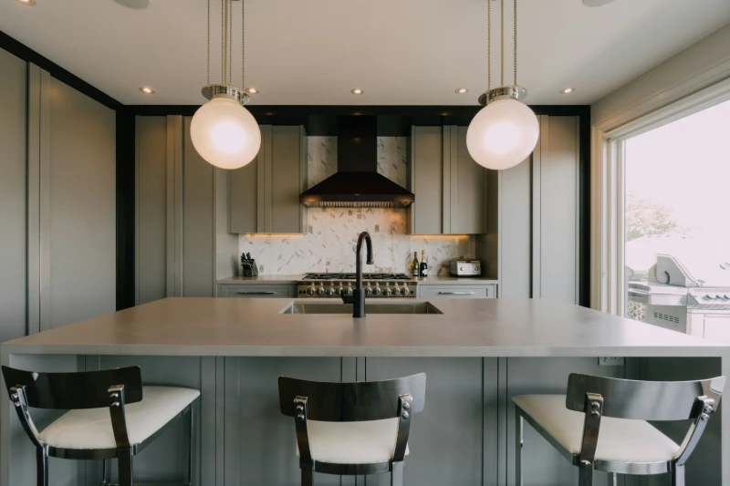 Layered kitchen lighting design in Brandon Manitoba home